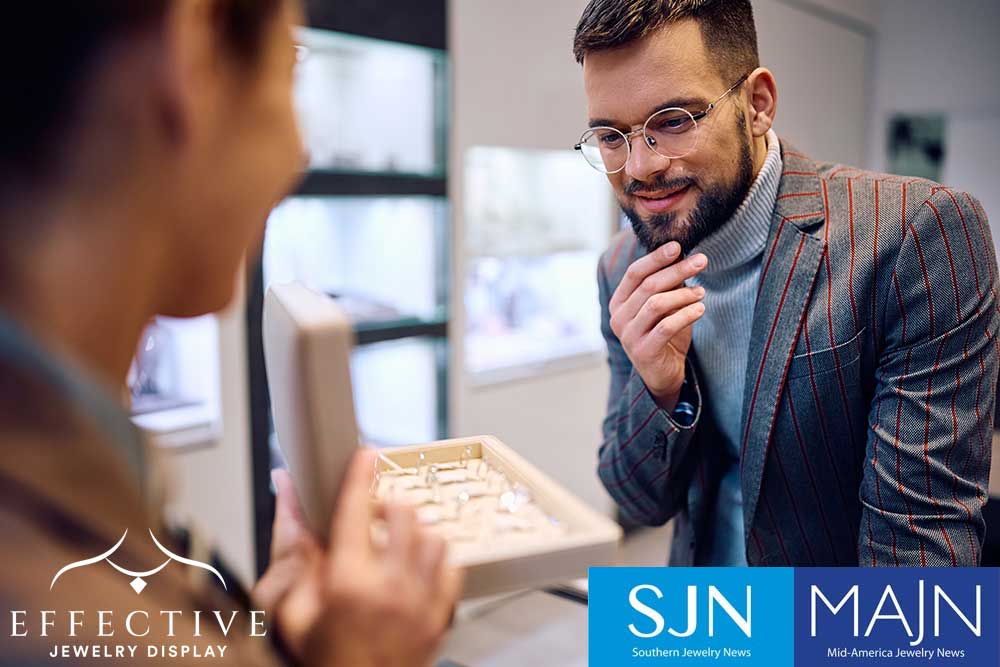 Man in jewelry store looking at jewelry