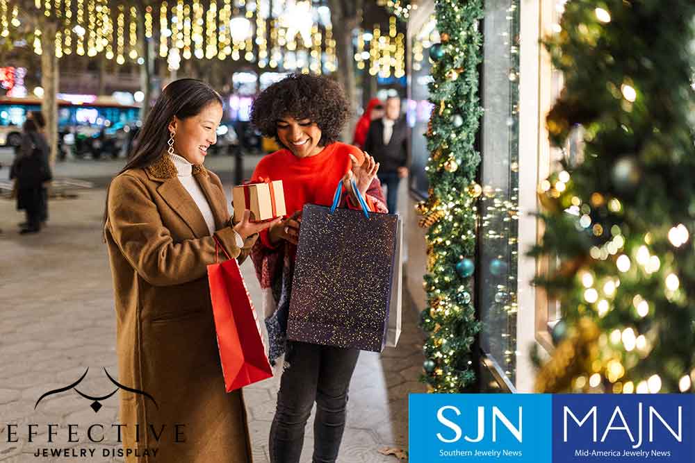2 women looking at a gift outside
